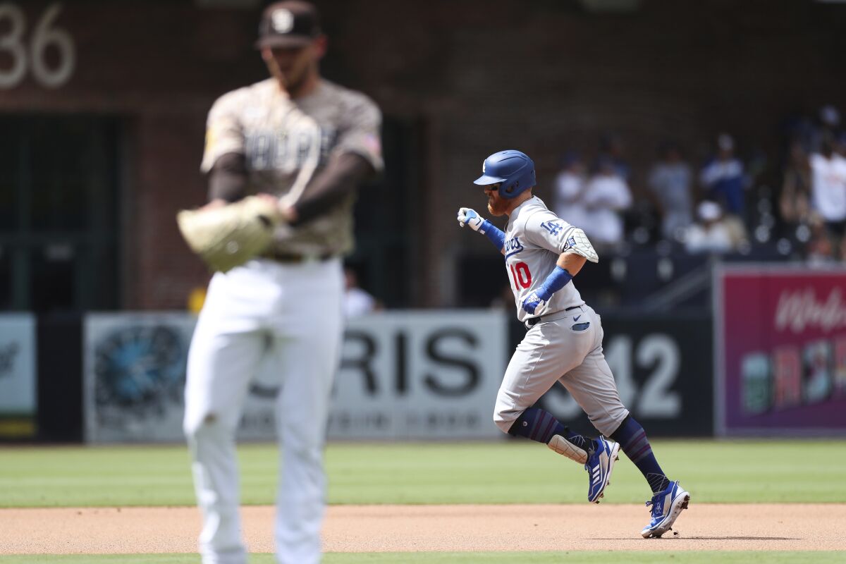 Justin Turner runs the bases after hitting a solo home run off Padres' Joe Musgrove in the fifth inning Sunday in San Diego.
