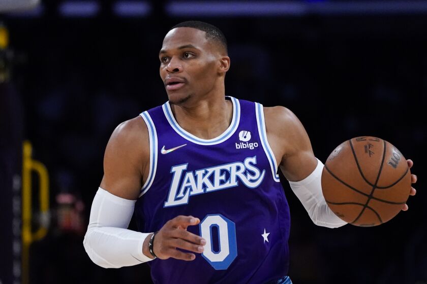 Los Angeles Lakers' Russell Westbrook dribbles the ball during the first half of an NBA basketball game against the Minnesota Timberwolves Friday, Nov. 12, 2021, in Los Angeles. (AP Photo/Jae C. Hong)