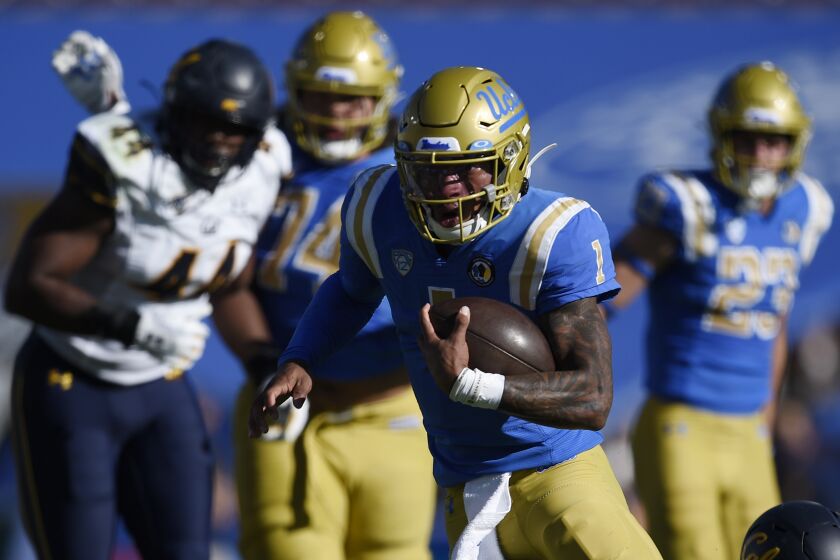 UCLA quarterback Dorian Thompson-Robinson runs the ball during the first half of an NCAA college football game against California in Los Angeles, Sunday, Nov. 15, 2020. (AP Photo/Kelvin Kuo)