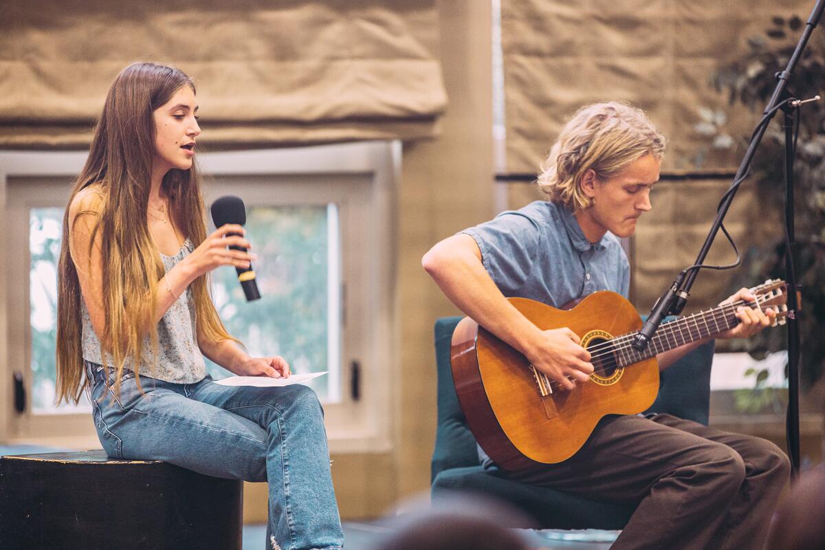 Tahlia Fisch and Mo Hetzer perform the song “This Can’t Continue” at the vigil in honor of Uvalde students.
