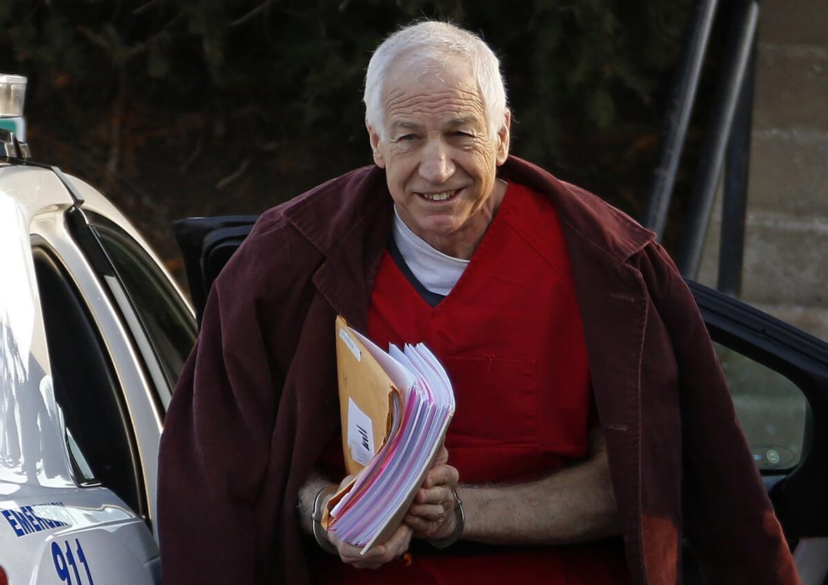 Former Penn State assistant football coach Jerry Sandusky arrives at the Centre County Courthouse for a post-sentencing hearing in January in Bellefonte, Pa. An attorney for Sandusky on Tuesday asked a three-judge appellate panel to grant him a new trial.