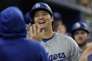 Los Angeles Dodgers' Shohei Ohtani (17) celebrates his 51 home run of the season.