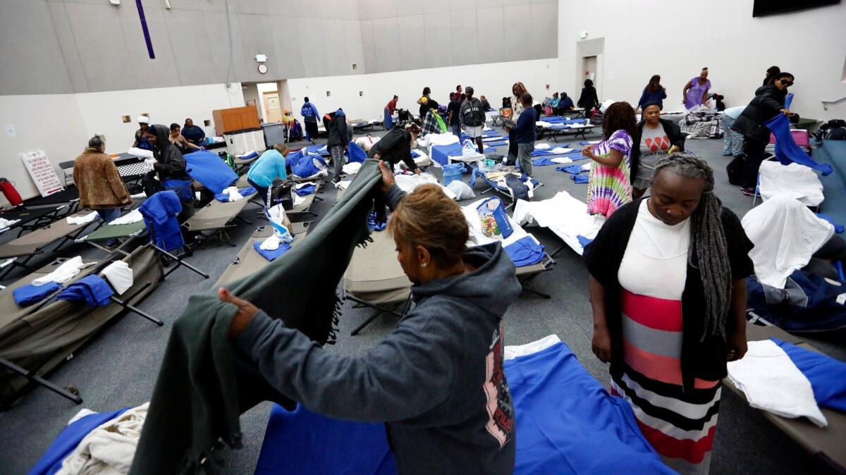 Homeless women prepare to bed down for the night in the chapel at the Union Rescue Mission.