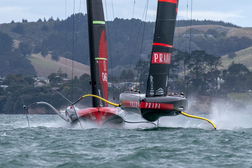 Italy's Luna Rossa, right, and Team New Zealand maneuver for the start of race two of the America's Cup on Auckland's Waitemata Harbour, Wednesday, March 10, 2021. (Chris Cameron/Photosport via AP)