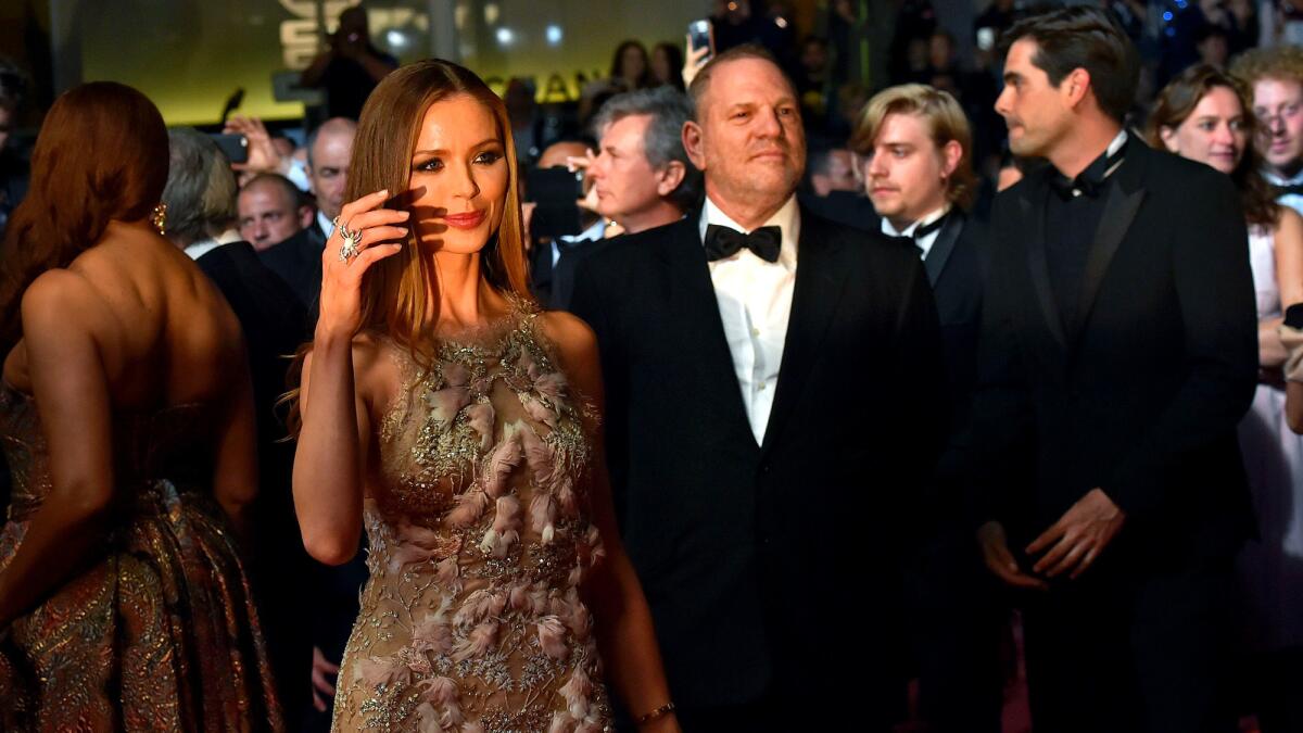 Georgina Chapman and her husband, Harvey Weinstein, arrive for a screening of the film "Hands of Stone" at the Cannes Film Festival.