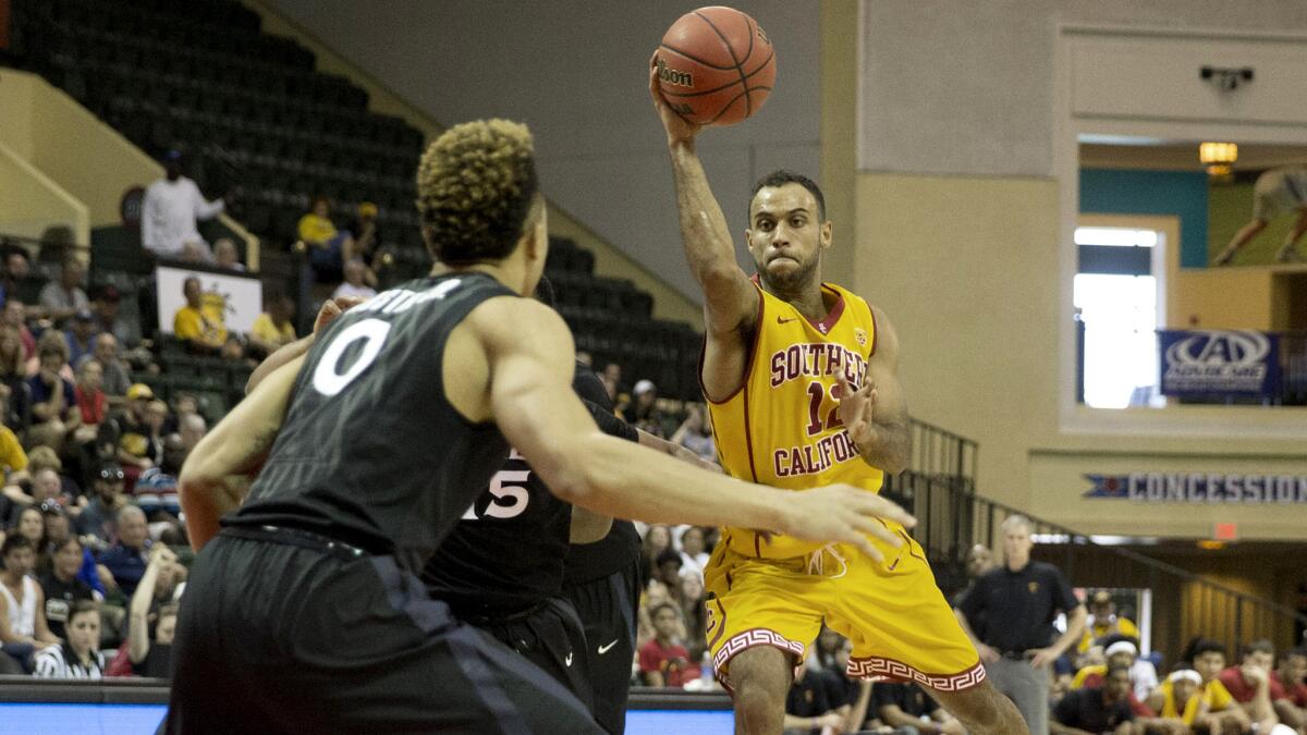 USC guard Julian Jacobs makes a pass after driving down the lane against Xavier in the first half Friday.