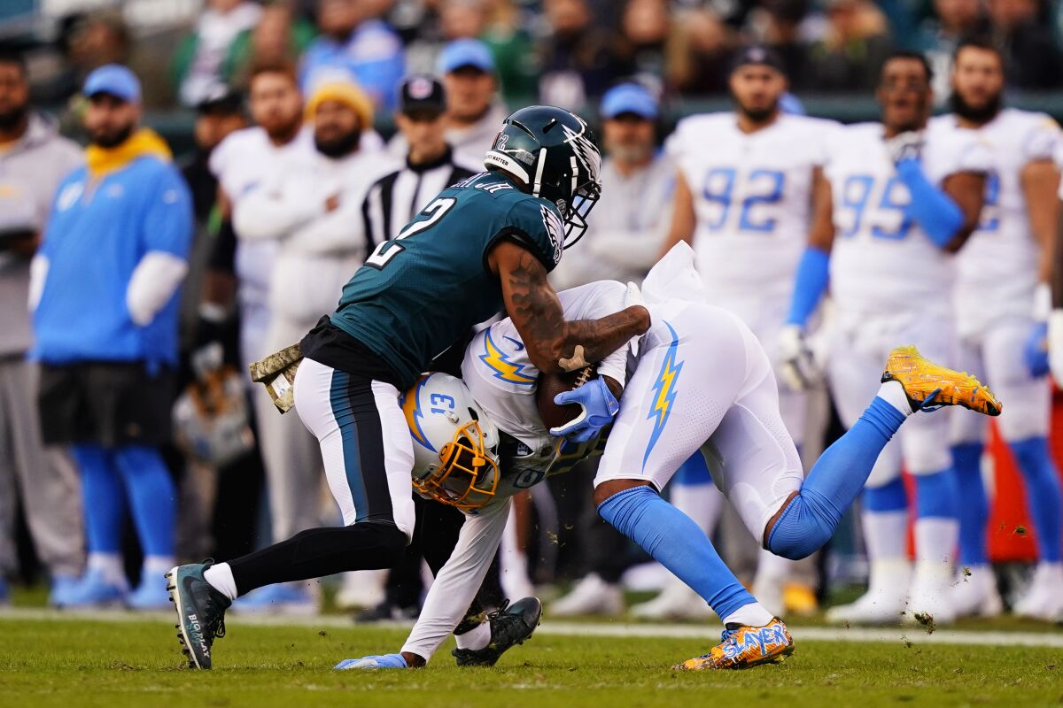 Eagles cornerback Darius Slay (2) tackles Chargers  receiver Keenan Allen in the first half.