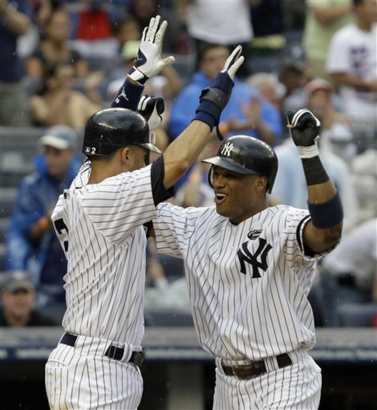 New York Yankees' Derek Jeter, left, and Robinson Cano, right