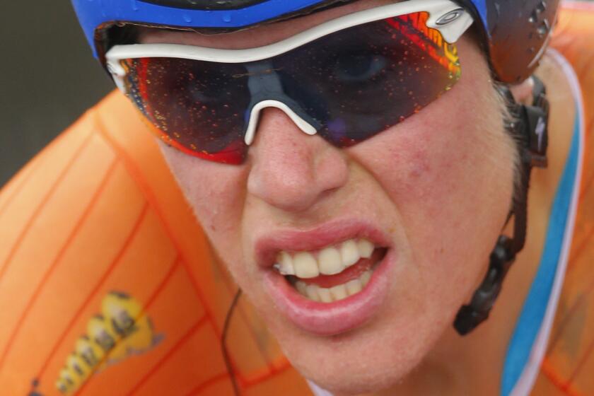 Defending champion Ellen van Dijk of The Netherlands competes to take a seventh place in the women's individual time trial event over 29.5 kilometers (18.3 miles) at the Road Cycling World Championships in Ponferrada, north-western Spain, Tuesday Sept. 23, 2014. (AP Photo/Daniel Ochoa de Olza)