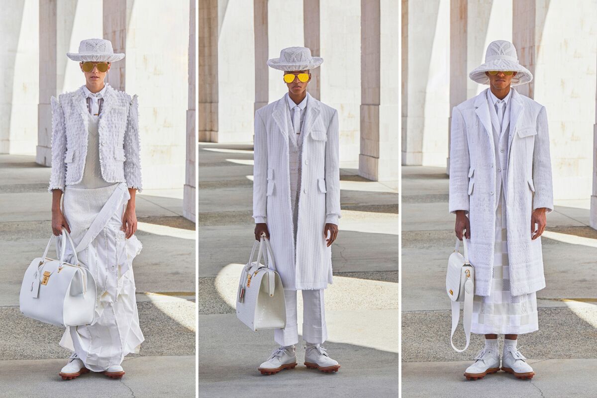 Three models dressed in all-white looks from the Thom Browne spring and summer 2021 collection.