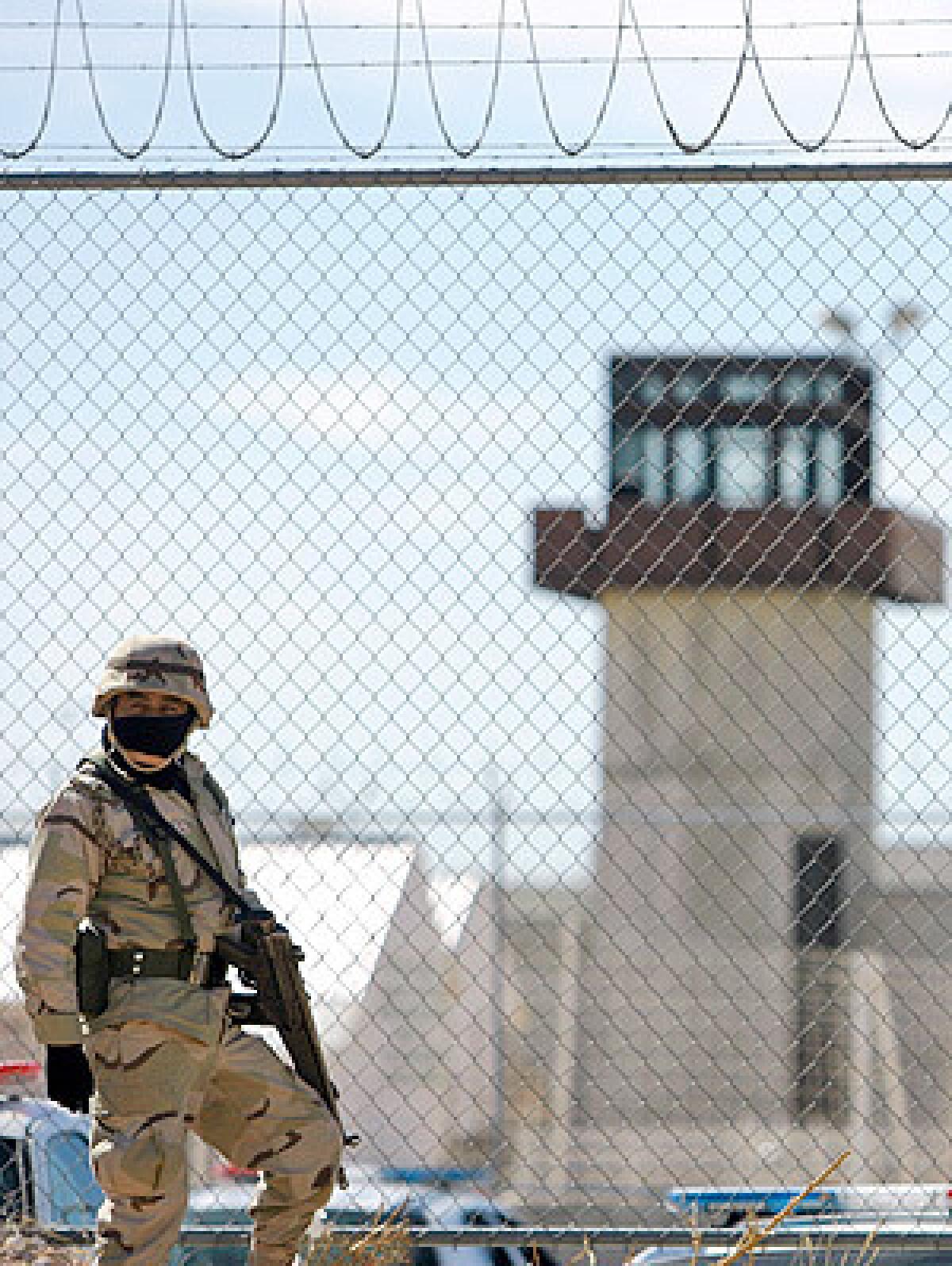 A soldier stands guard at the prison in Ciudad Juarez during the riot. The violence comes as the ravaged city is being placed under military control