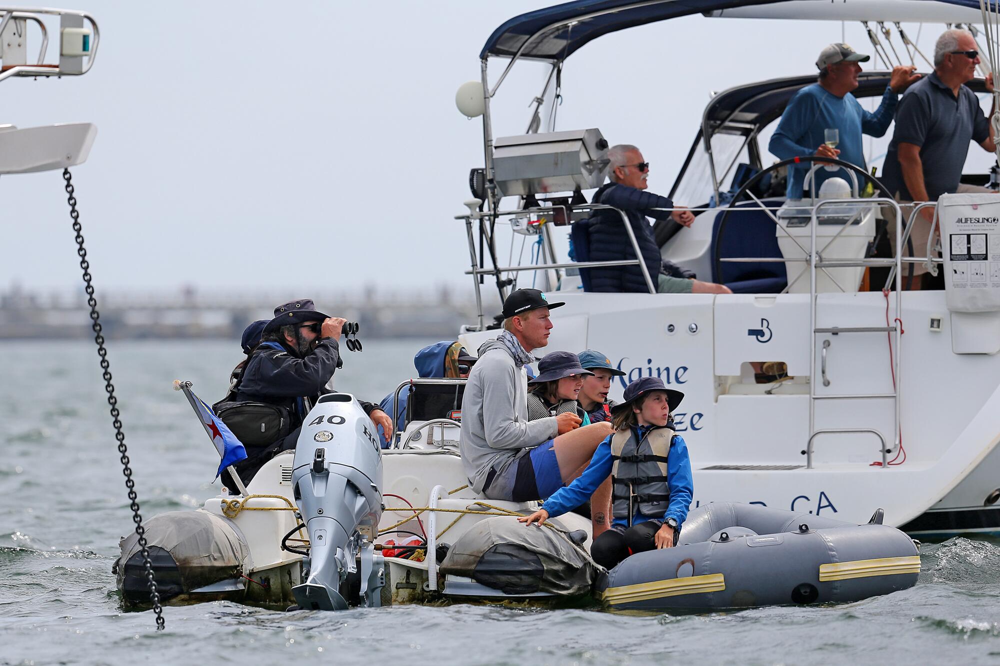 Spectators watch from a sailboat in San Pedro Oracle Los Angeles Sail Grand Prix
