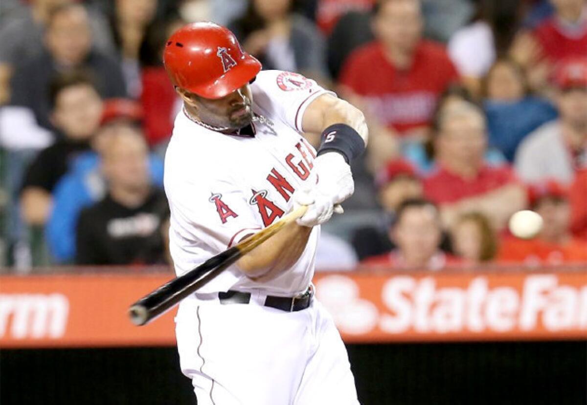 Angels slugger Albert Pujols was supposed to play first base on Sunday, but Manager Mike Scioscia changed plans.