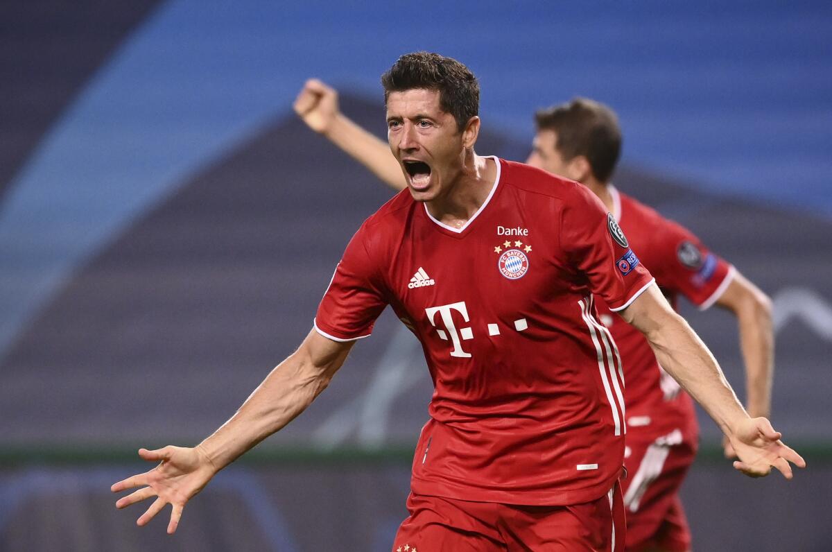Bayern's Robert Lewandowski celebrates after scoring his side's third goal 