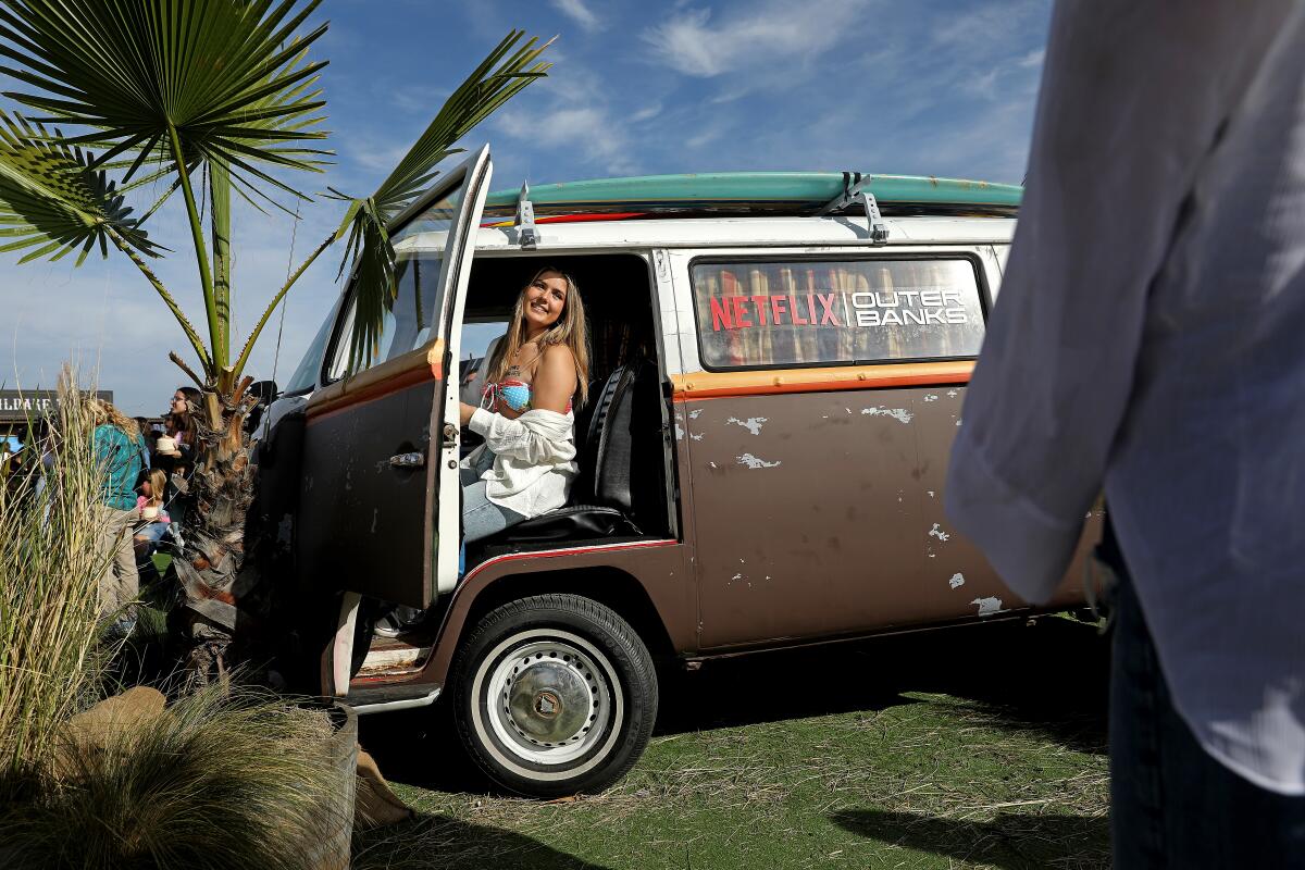 Kiana Hendricks, 17, of Newport Beach, poses for a photo in a Volkswagen Bus prop.