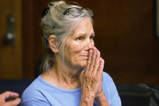 FILE - In this Sept. 6, 2017, file photo, Leslie Van Houten reacts after hearing she is eligible for parole during a hearing at the California Institution for Women in Corona, Calif. A California panel has recommended parole for Charles Manson follower Van Houten, who has spent nearly five decades in prison. The recommendation was made Thursday, July 23, 2020, although Gov. Gavin Newsom could decide to deny it. (Stan Lim/Los Angeles Daily News via AP, Pool, File)