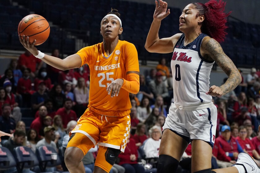 Tennessee guard Jordan Horston (25) attempts a layup as Mississippi forward Shakira Austin (0) defends during the first half of an NCAA college basketball game in Oxford, Miss., Sunday, Jan. 9, 2022. (AP Photo/Rogelio V. Solis)
