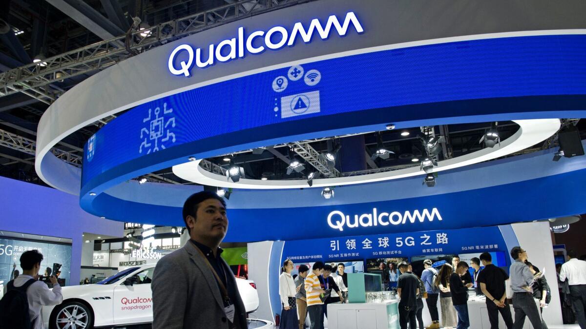 Attendees visit the Qualcomm stand during China Mobile Global Partner Conference 2018 in Guangzhou.