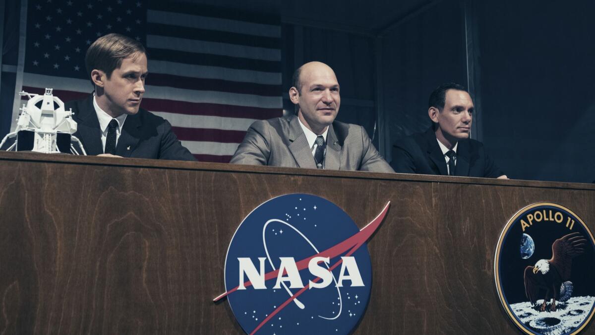 Ryan Gosling, from left, Corey Stoll and Lukas Haas in a scene from "First Man."