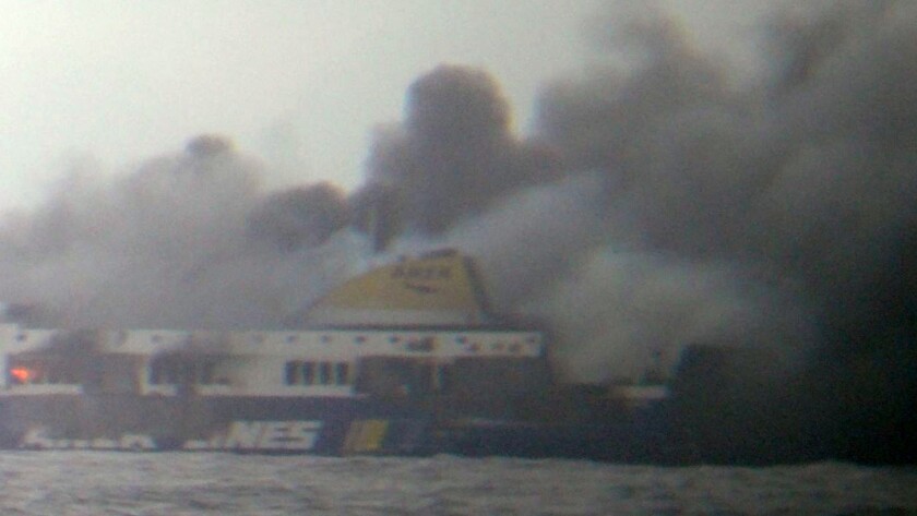 Smoke rises from the Italian-flagged Norman Atlantic ferry after it caught fire in the Adriatic Sea, trapping hundreds of passengers on the top decks as gale-force winds and choppy seas hampered their evacuation.