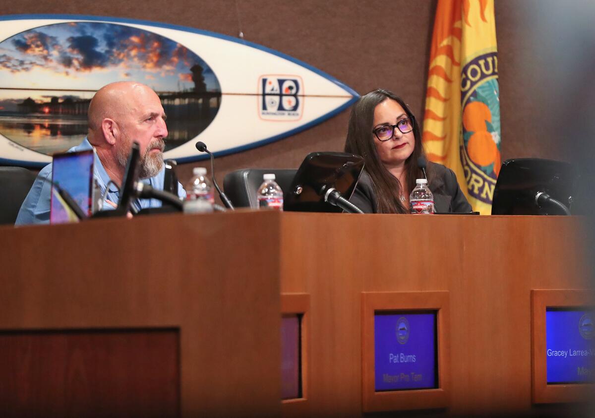 Mayor Pro Tem Pat Burns and Mayor Gracey Van Der Mark listen to public comments.