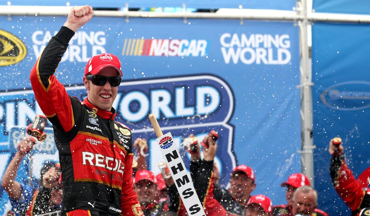 NASCAR driver Brad Keselowski celebrates in Victory Lane after winning the Sprint Cup Series Camping World RV Sales 301 at New Hampshire Motor Speedway on Sunday.
