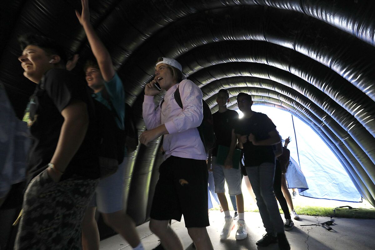 SDUSD Superintendent of Public Education Cindy Marten was involved with a pep rally at Clairemont High School where students walked through a blow-up tunnel usually seen at Friday night football games.