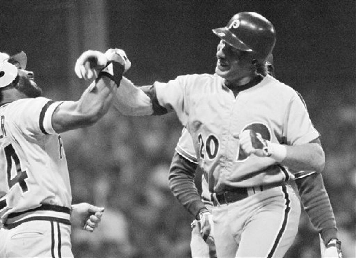 FILE - In this Aug. 9, 1981, file photo, Philadelphia Philles Mike Schmidt, right, is greeted at home plate by Mike Easler of the Pittsburgh Pirates, after hitting an two-run home run against the American League during the eight inning of baseball's All Star game in Cleveland. The National League won 5-4. (AP Photo/File)