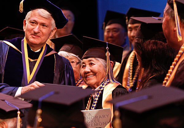 Masaye Nagao Nakamura poses for a photo with UCLA Chancellor Gene Block after receiving her honorary degree.