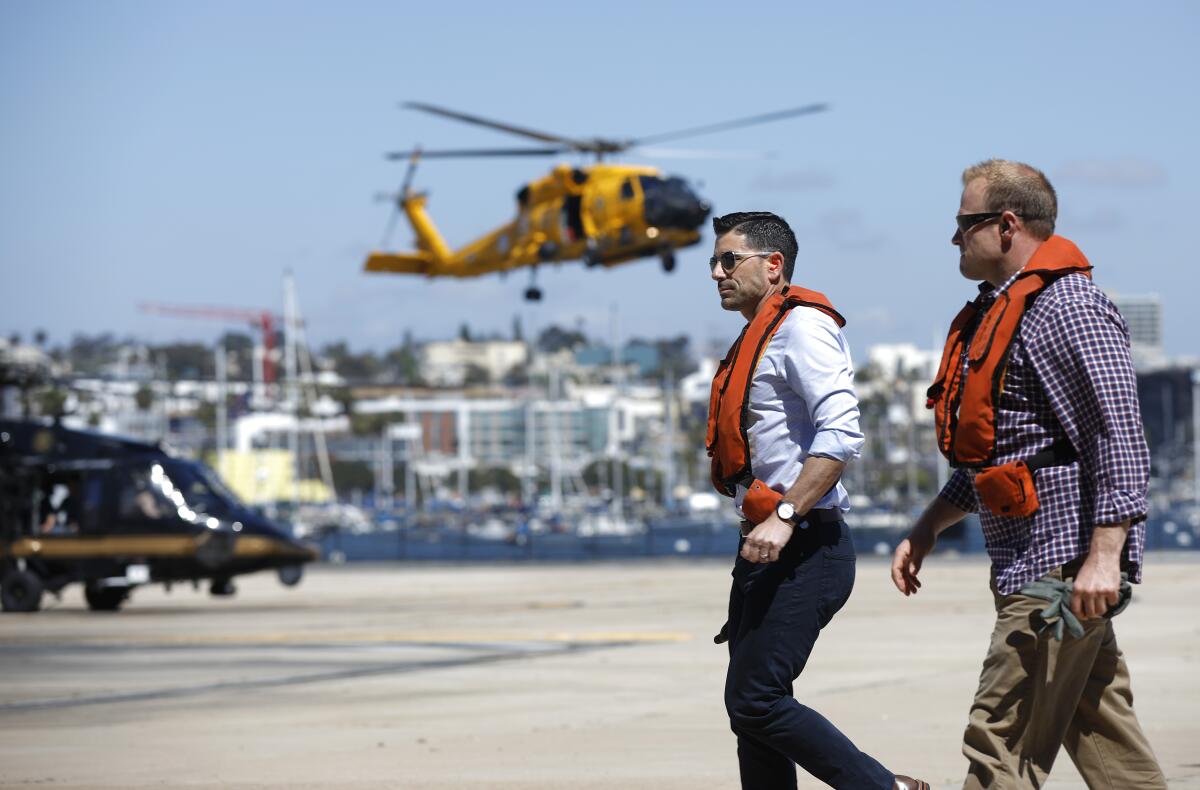 Chad F. Wolf, acting Secretary of Homeland Security, left, arrives at the U.S. Coast Guard Sector San Diego after taking a helicopter tour of the San Diego Sector border region on May 13, 2020.