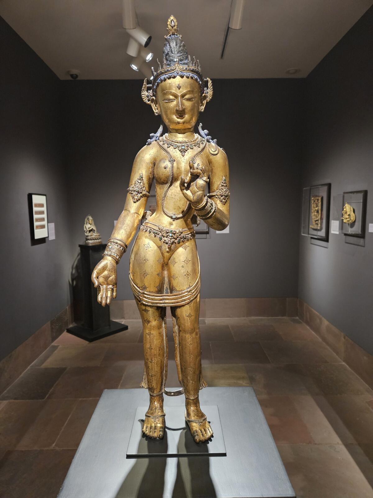 "Tara," 14th century, Nepal; gilt-copper alloy with semiprecious stones and pigment