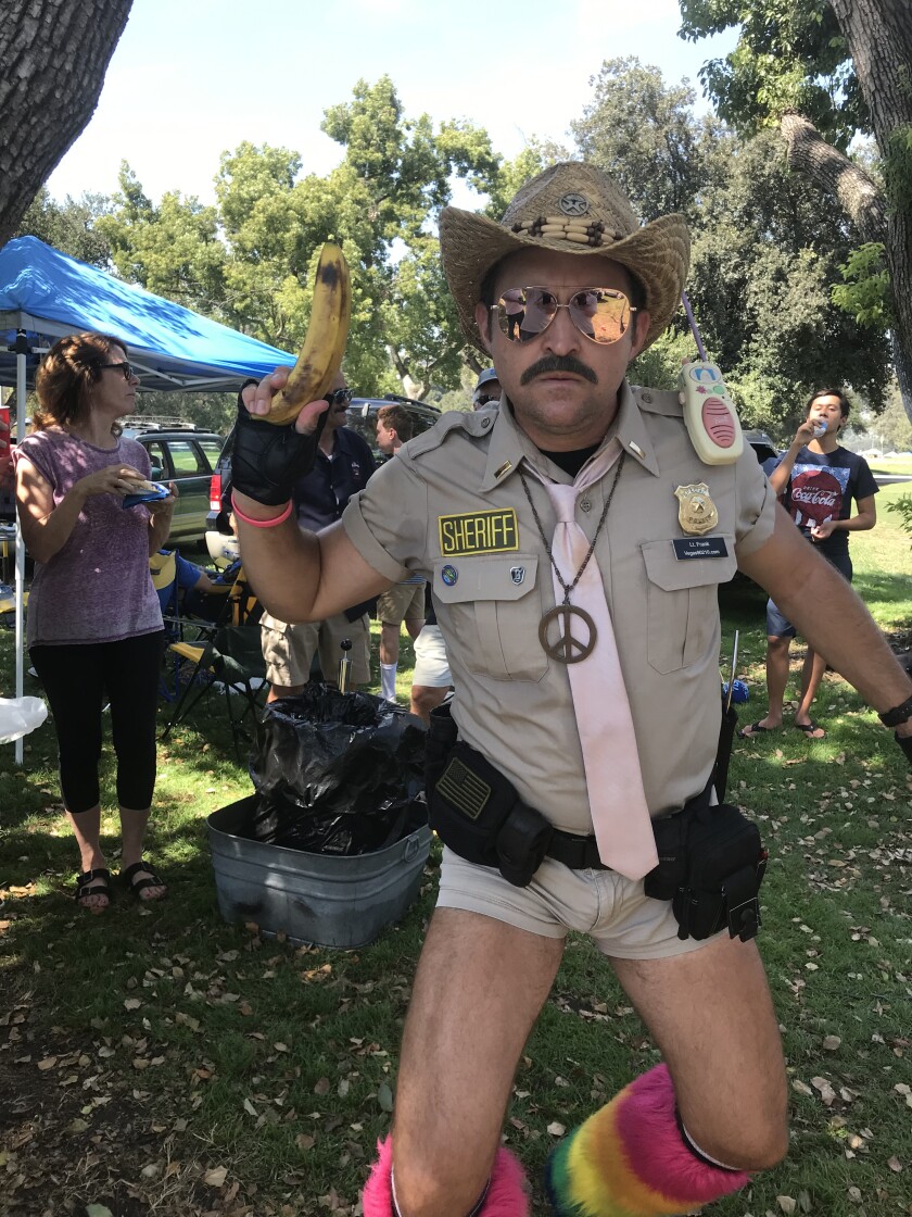 The faux law, a tailgate party crasher dressed for “Reno 911!”