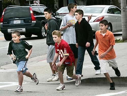 From left, Dash Dobrofsky, 9, Brandon Nelson, 14, Justin Nelson, 9, Spyder Dobrofsky, 13, Trent Nelson, 12, and Paul Bogosian, 14, are off on their quest to photograph exotic cars in Beverly Hills.