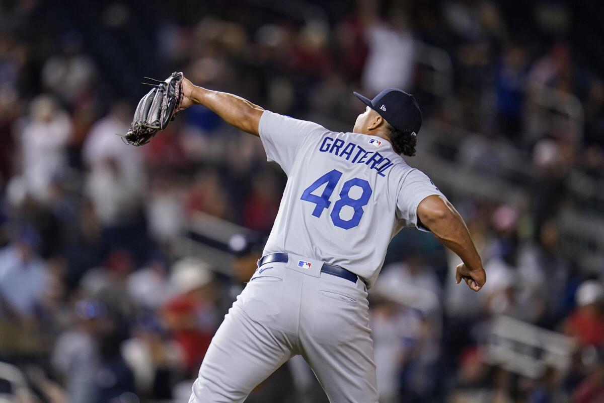Dodgers relief pitcher Brusdar Graterol reacts after recording the last out of Friday's win over the Washington Nationals.