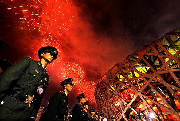 Soldiers outside the Bird's Nest during the closing ceremony of the 2008 Beijing Olympics.