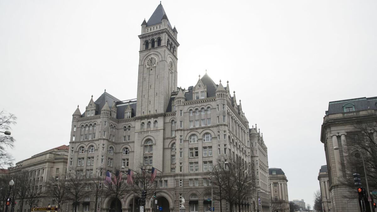 The Old Post Office Pavilion Clock Tower, which remains open during the partial government shutdown, is seen above the Trump International Hotel in Washington.