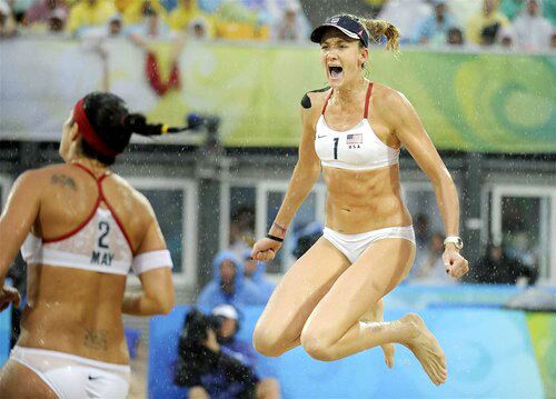 American teammates Kerri Walsh, right, and Misty May-Treanor begin celebrating their victory in the women's beach volleyball final on Thursday in Beijing.