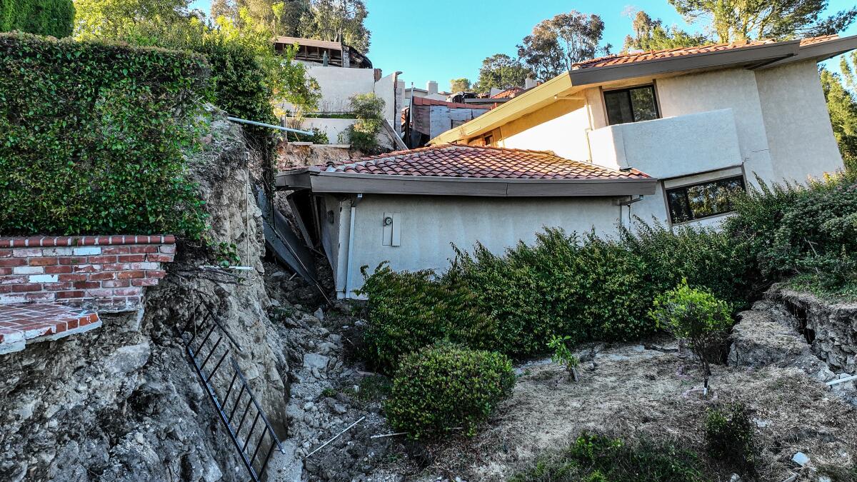 A hillside in Rolling Hills Estates collapses, bringing down a house