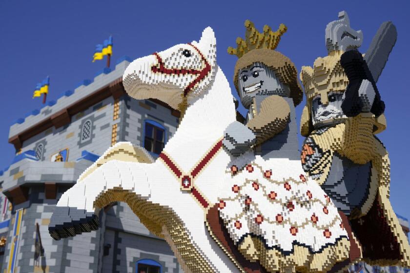 A statue made from Legos is at the front entrance to Legoland's newest addition, the Castle Hotel. The hotel still under construction is due to open in the few weeks.