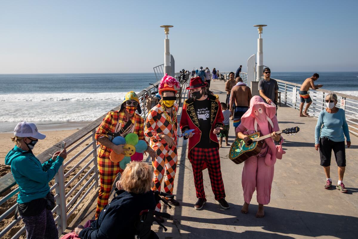 Singers perform for   passersby on the Hermosa Beach Pier.