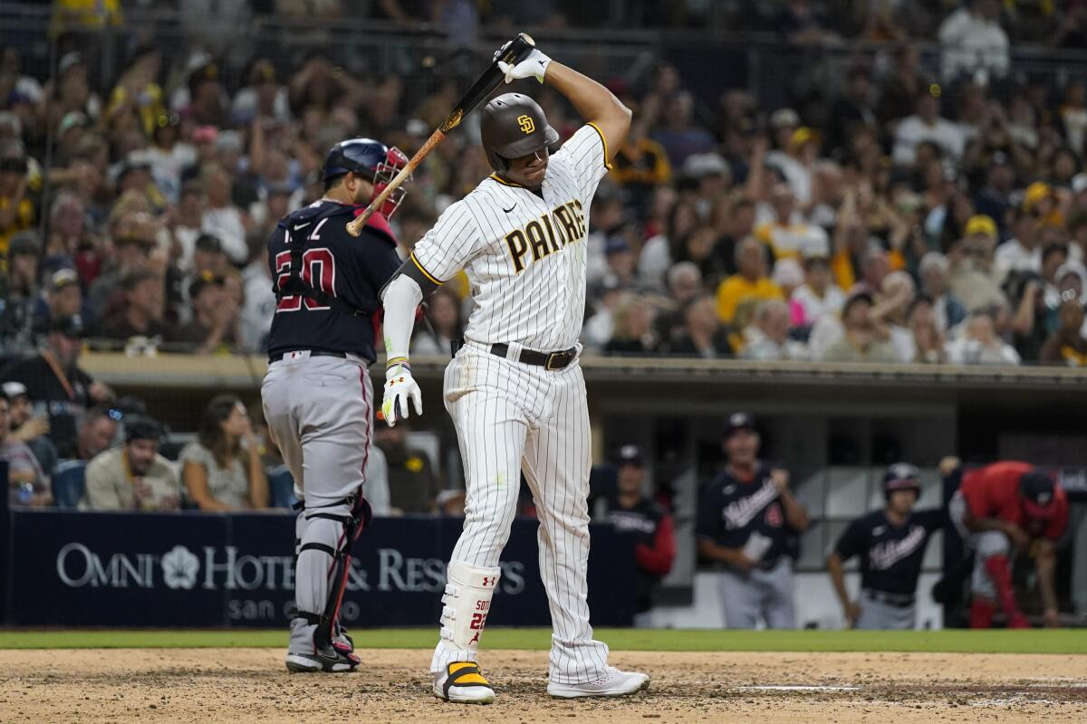 San Diego Padres' Juan Soto throws his bat after striking out with the bases loaded to end the seventh inning of the team's baseball game against the Washington Nationals, Thursday, Aug. 18, 2022, in San Diego. (AP Photo/Gregory Bull)