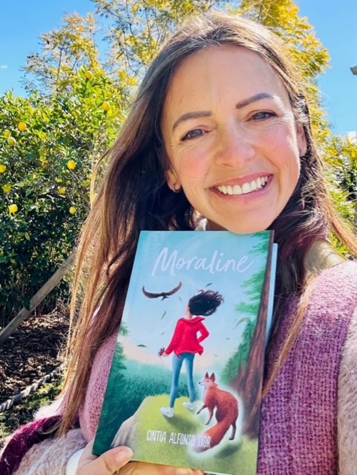 Cintia Alfonso Fior displays her novel, “Moraline.”