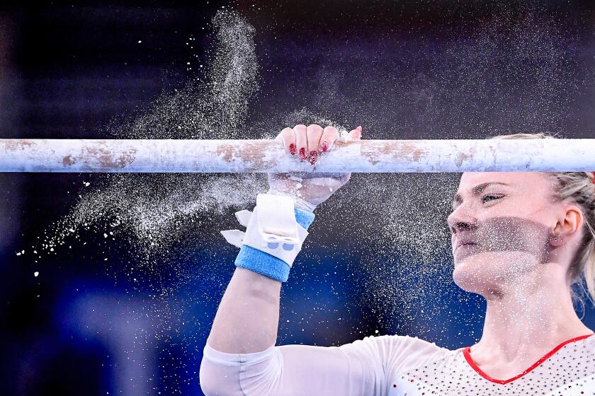 -TOKYO,JAPAN July 24, 2021: Poland's Gabriela Sansal prepares to compete on the uneven bars in the women's team qualifying at the 2020 Tokyo Olympics. (Wally Skalij /Los Angeles Times)