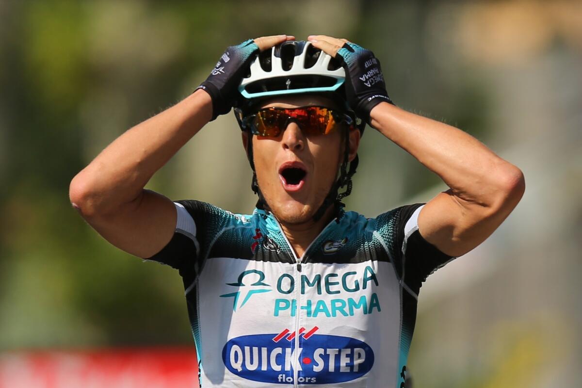 Matteo Trentin celebrates after winning Stage 14 of the Tour de France on Saturday.
