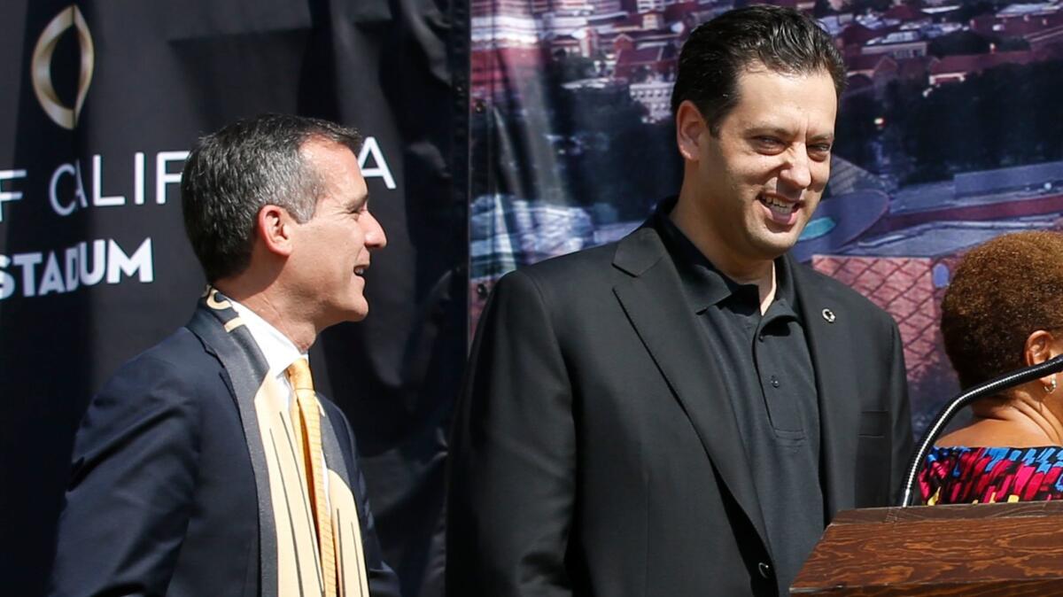 Los Angeles Mayor Eric Garcetti (left) joins with Steven Sugarman, then-CEO of Banc of California, as naming rights are announced in August for a new stadium near USC that will house the Los Angeles Football Club soccer team.