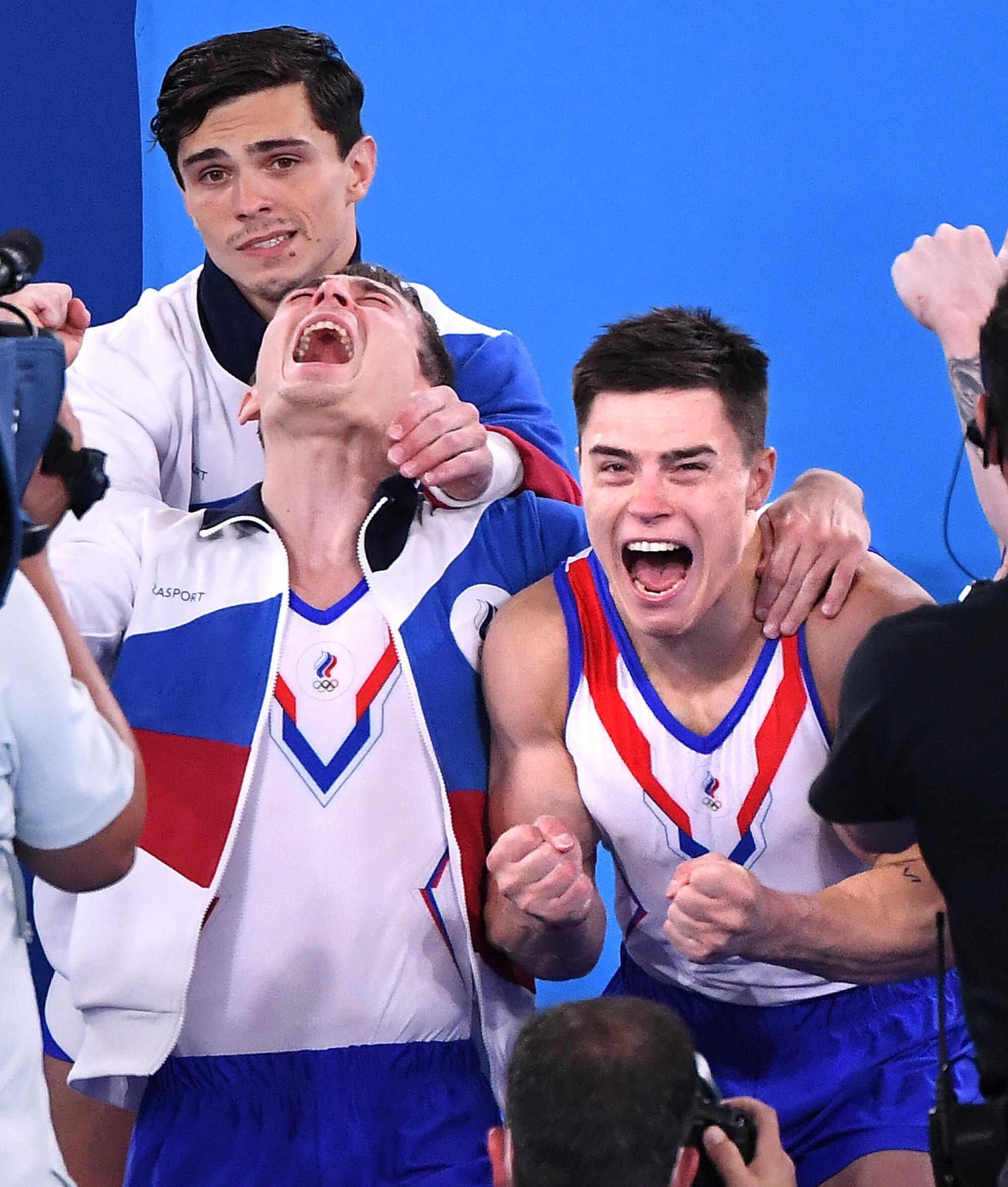 ROC's Nikita Nagornyy, right, reacts with teammates as they realize they won the gold medal in the men's team final.
