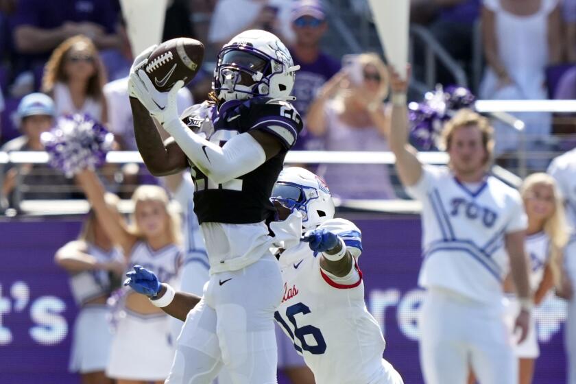 TCU wide receiver Major Everhart (22) catches a pass in front of SMU safety Ahmaad Moses (16) during the first half of an NCAA college football game Saturday, Sept. 23, 2023, in Fort Worth, Texas. (AP Photo/LM Otero)