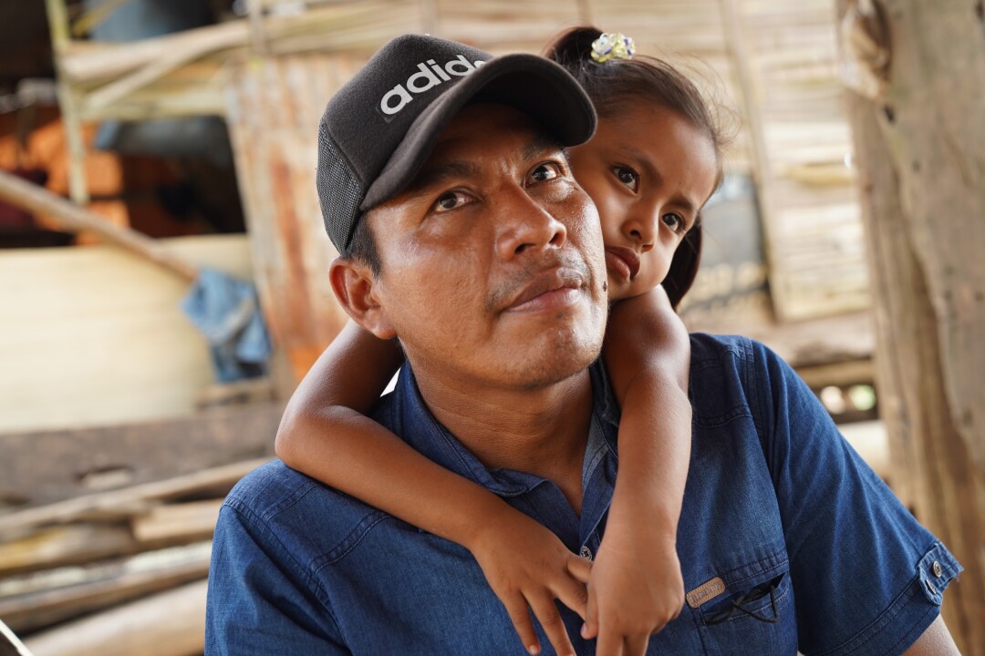 Marlon Ashanga, 35, and his daughter Elma Coral, 4, at their home in the Belen district of Iquitos, Peru. 