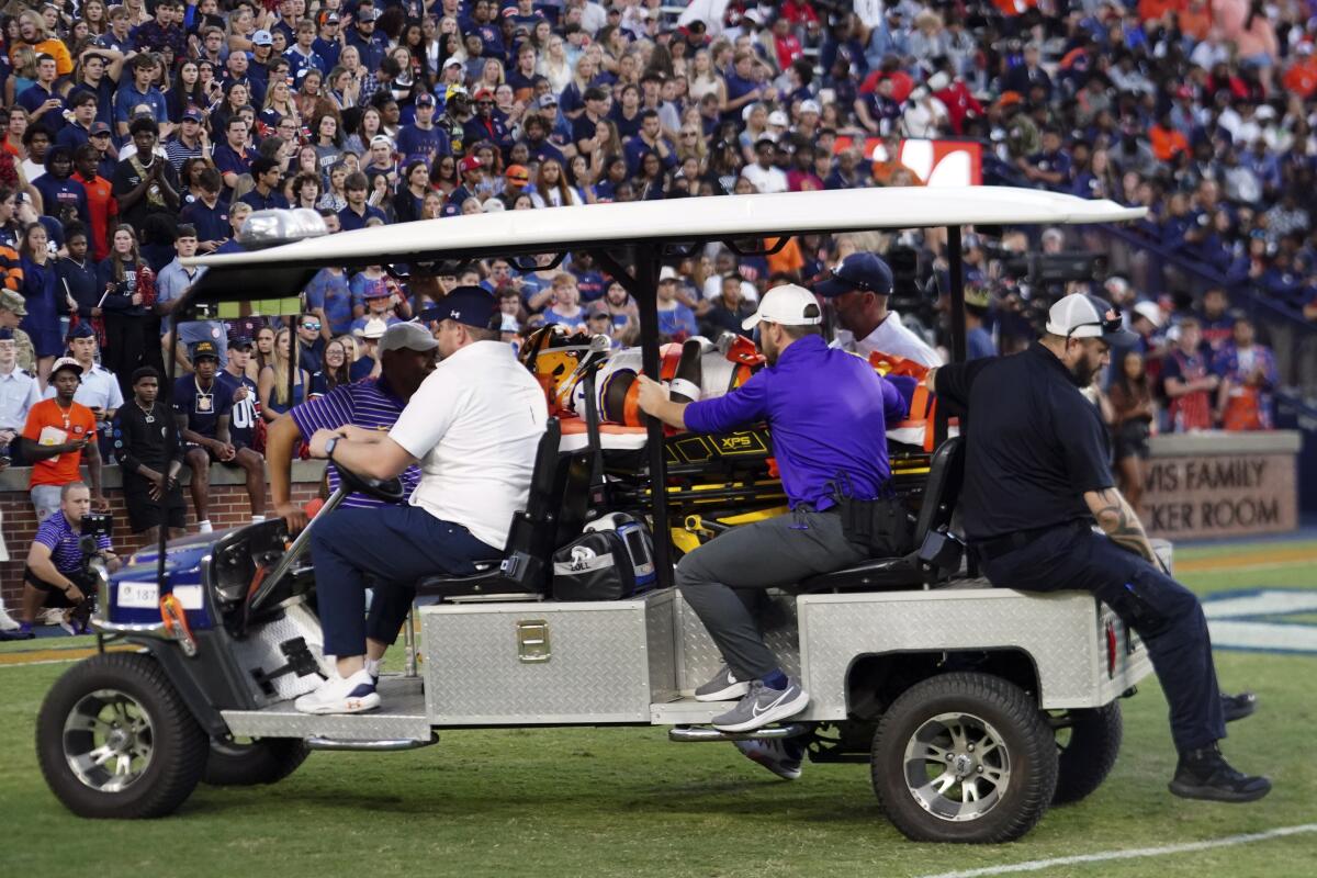 LSU's Sevyn Banks is transported to a waiting ambulance after he was injured on the opening kickoff in the first half of an NCAA college football game against Auburn, Saturday, Oct. 1, 2022, in Auburn, Ala. (AP Photo/John Bazemore)