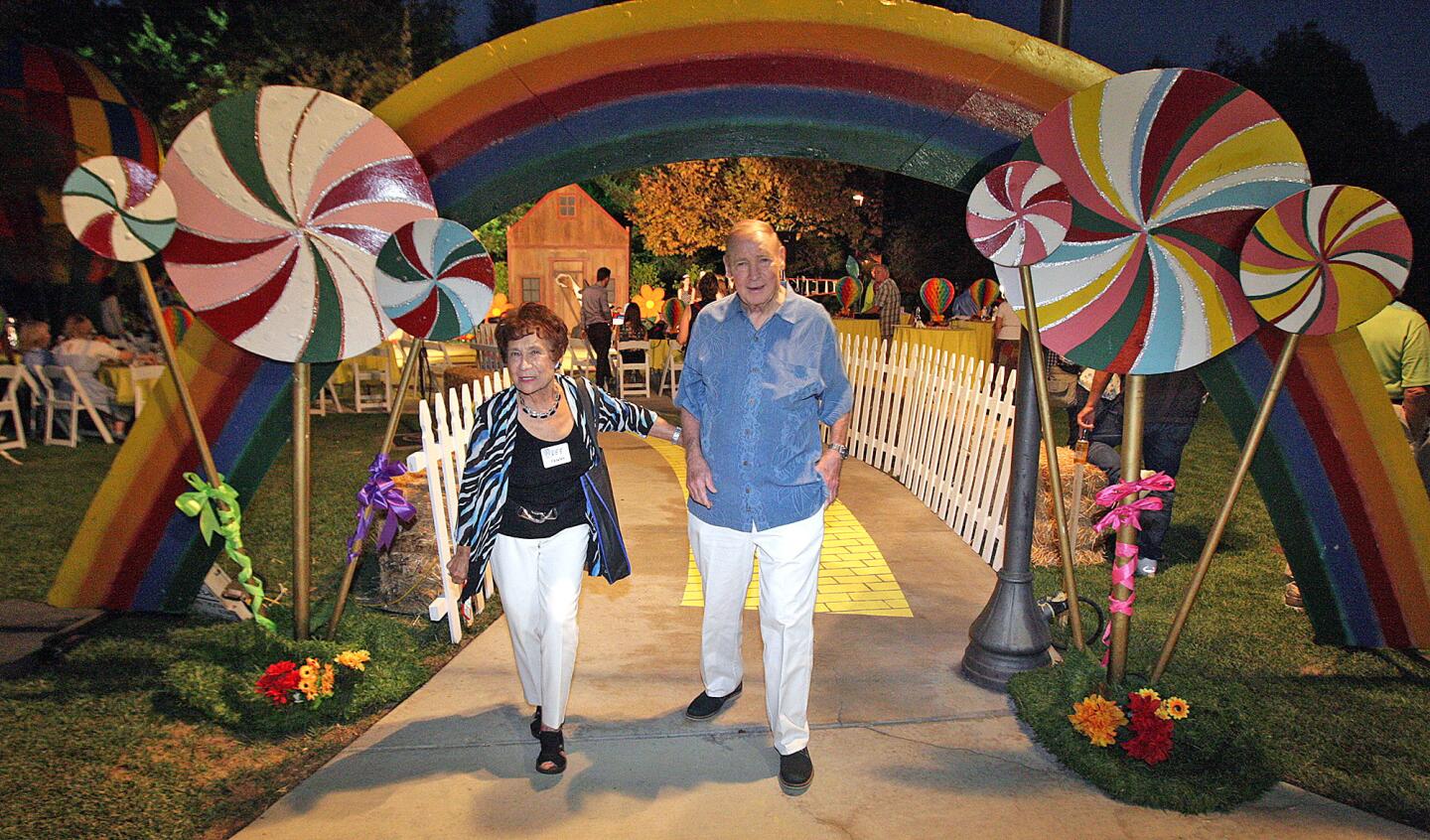 Dee and Fraser Draper, 40-year residents of La Cañada find themselves under the rainbow at Olberz Park in La Cañada Flintridge at the annual La Cañada Flintridge Chamber of Commerce mixer on Thursday, September 17, 2015.
